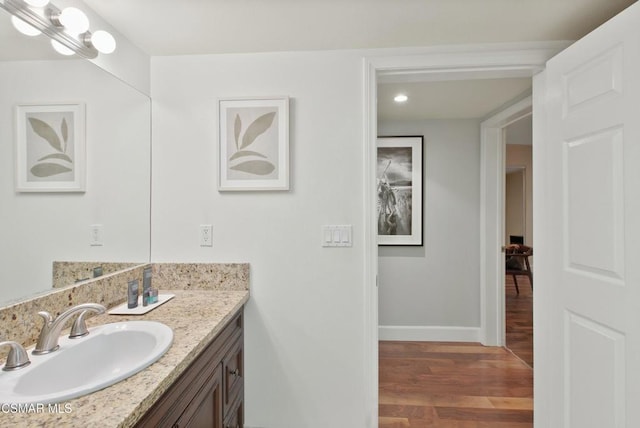 bathroom featuring wood-type flooring and vanity