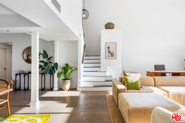 stairway with hardwood / wood-style flooring