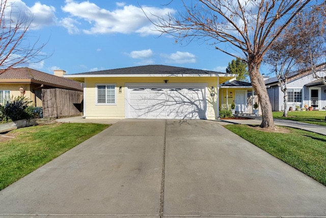 ranch-style home with a garage and a front yard