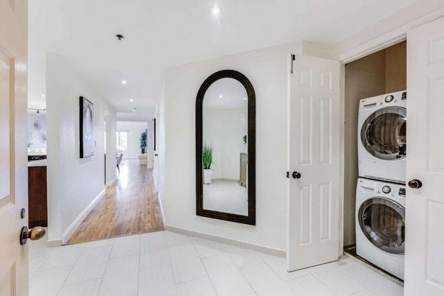 washroom with stacked washer and dryer