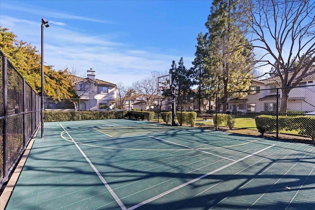 view of sport court featuring basketball hoop