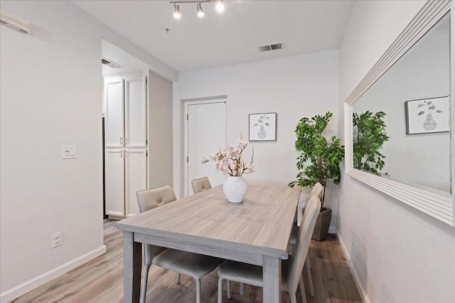 dining room with light hardwood / wood-style floors