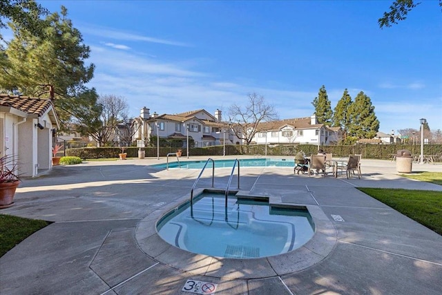 view of swimming pool featuring a patio area