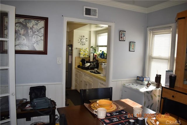 office with crown molding and plenty of natural light