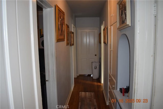 hallway featuring dark hardwood / wood-style flooring