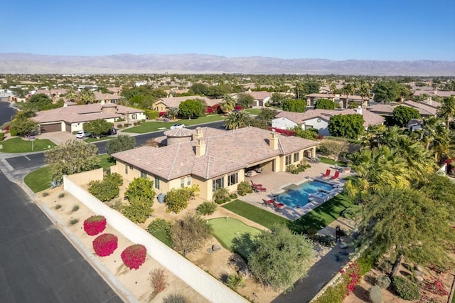 birds eye view of property featuring a mountain view