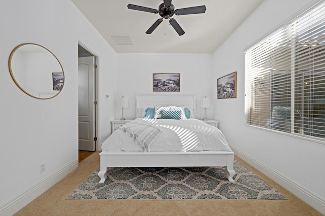 bedroom with light colored carpet and ceiling fan