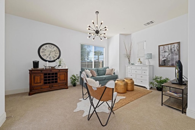 living room featuring an inviting chandelier and light colored carpet