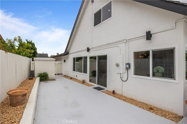 back of house with a patio