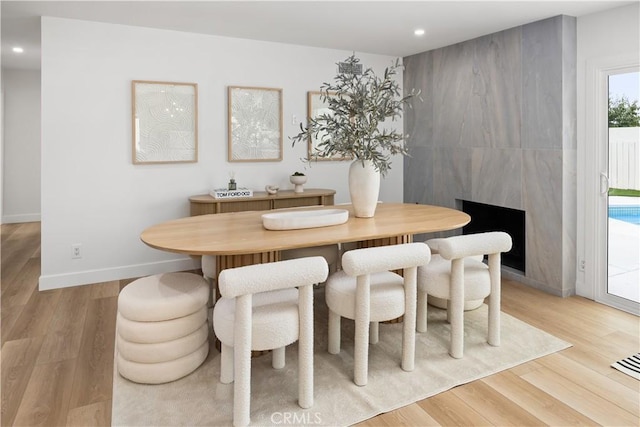 dining space with light hardwood / wood-style flooring