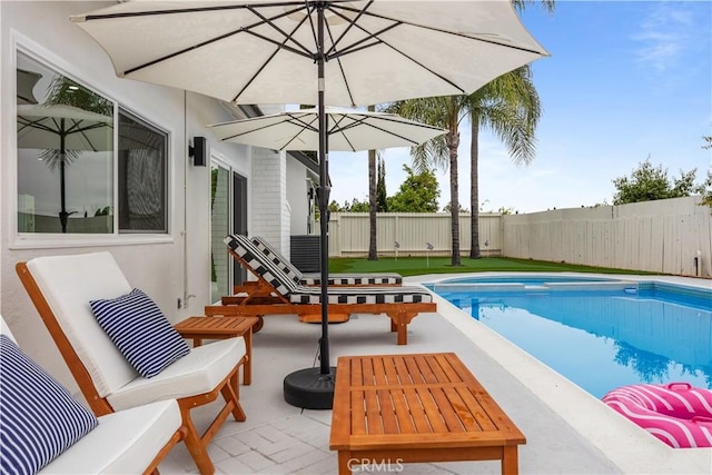 view of pool featuring a patio