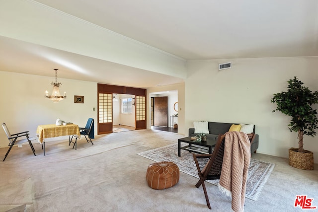 living room featuring lofted ceiling, a chandelier, carpet, and ornamental molding