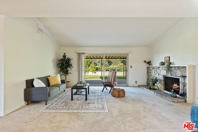 living room featuring a fireplace, carpet floors, and ornamental molding