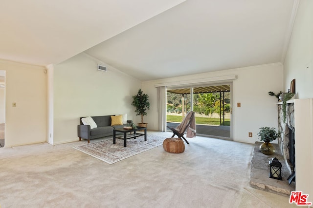 sitting room with light carpet and vaulted ceiling