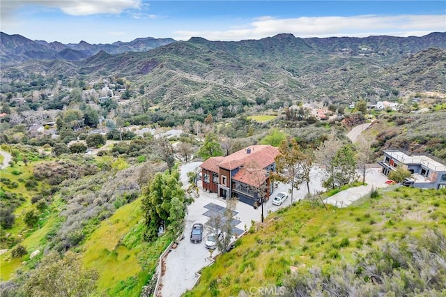 drone / aerial view featuring a mountain view