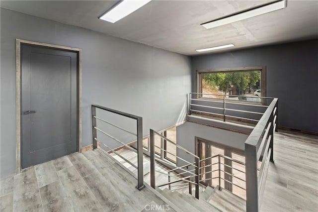 stairs with wood-type flooring