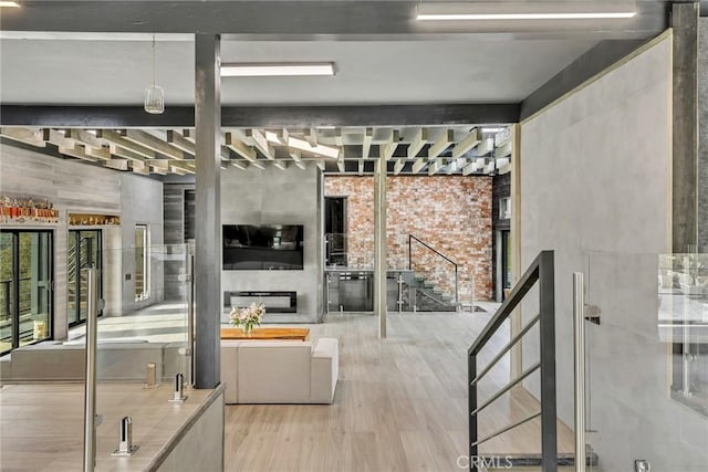 interior space featuring wood-type flooring and a fireplace