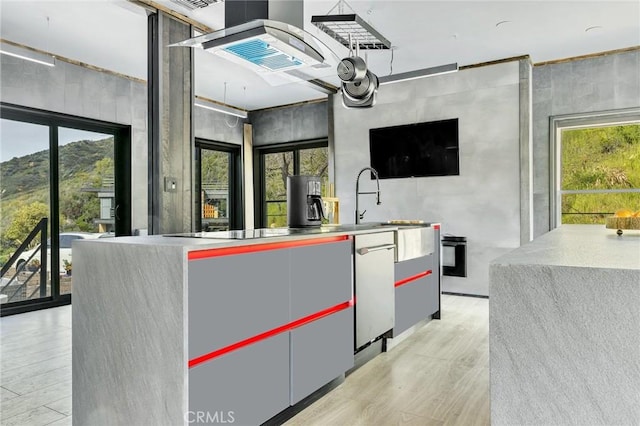 bar with a mountain view, black electric stovetop, and plenty of natural light