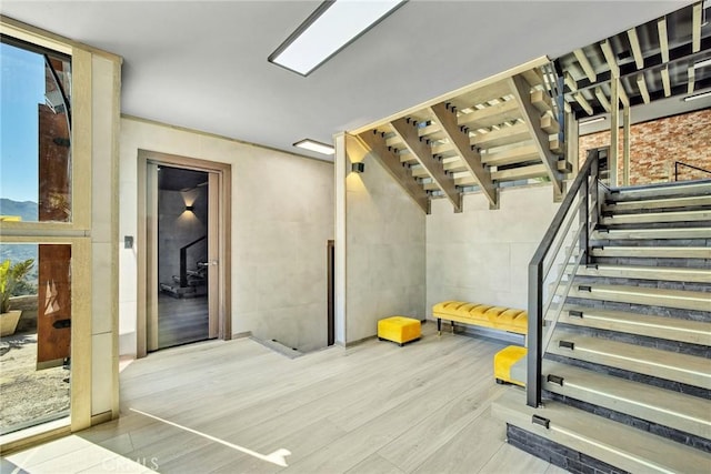 workout area featuring light hardwood / wood-style floors