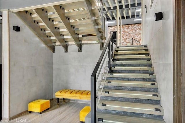 stairway featuring hardwood / wood-style flooring