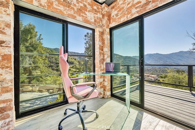 sunroom / solarium with a mountain view