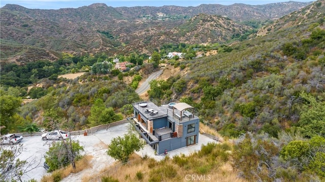 birds eye view of property with a mountain view