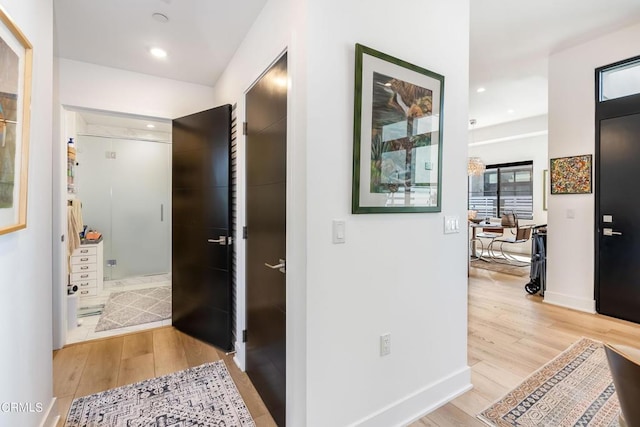 corridor featuring light hardwood / wood-style floors