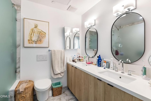 bathroom with toilet and vanity