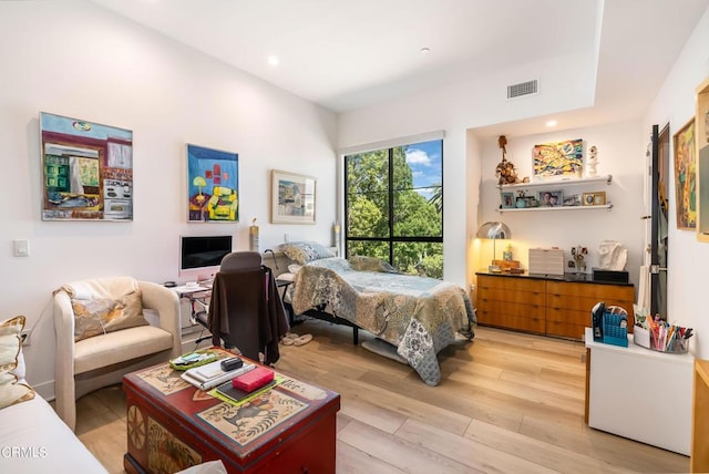 bedroom with light hardwood / wood-style floors