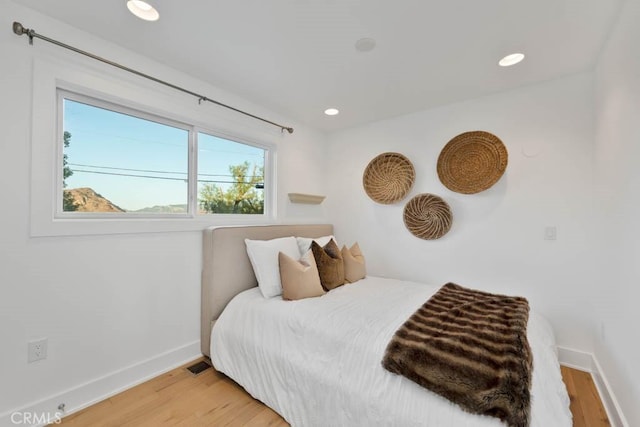 bedroom featuring hardwood / wood-style floors