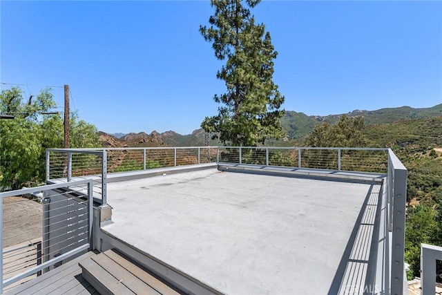 wooden deck featuring a mountain view