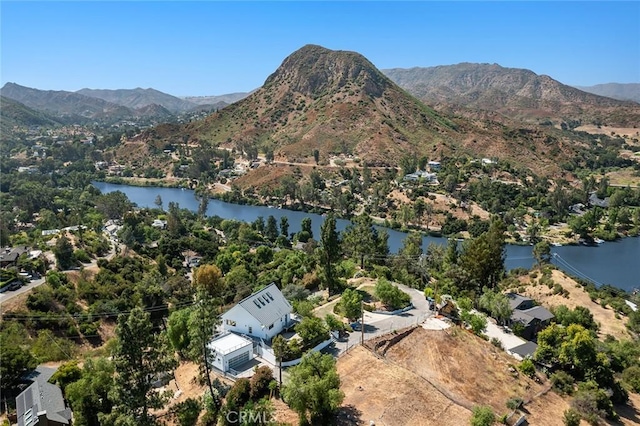 drone / aerial view with a water and mountain view