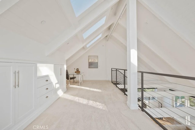 bonus room featuring light colored carpet and vaulted ceiling with skylight