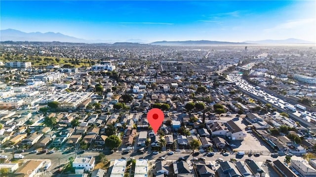 birds eye view of property with a mountain view