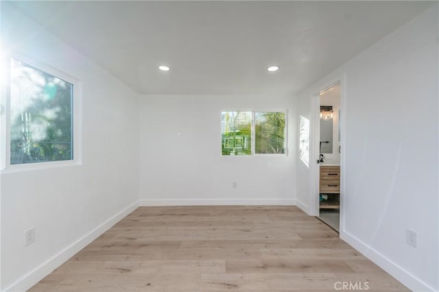 unfurnished room featuring light hardwood / wood-style floors