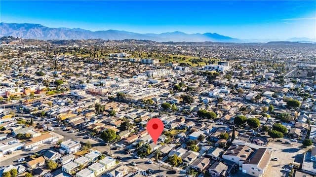 birds eye view of property with a mountain view