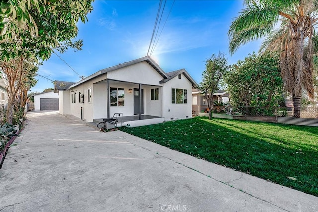 view of front of property with a garage and a front lawn