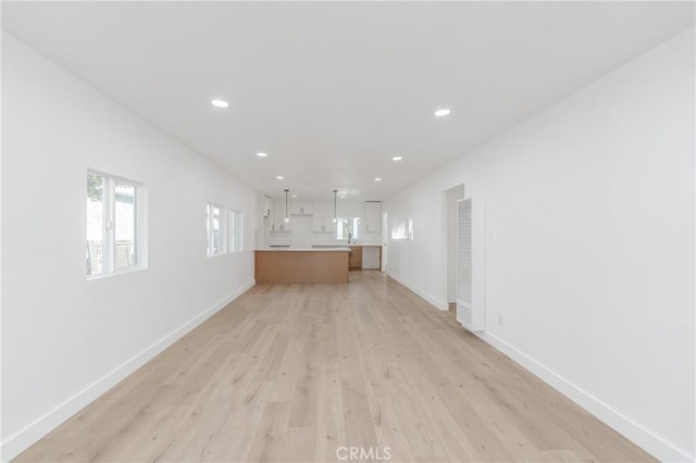 unfurnished living room with light hardwood / wood-style flooring