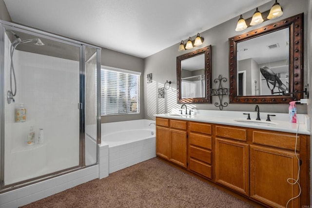 bathroom featuring vanity and shower with separate bathtub