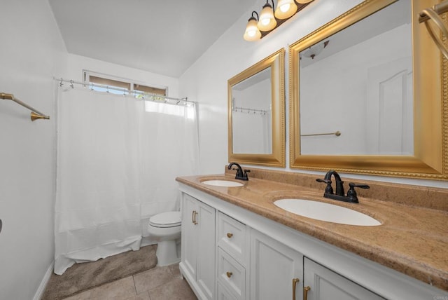 bathroom with vanity, toilet, curtained shower, and tile patterned flooring