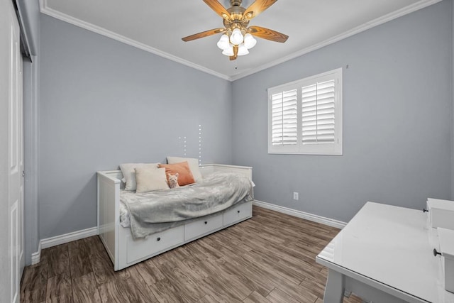 bedroom featuring ceiling fan, hardwood / wood-style floors, and ornamental molding