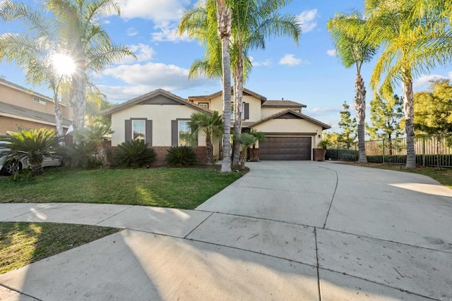 view of front of property with a garage and a front yard