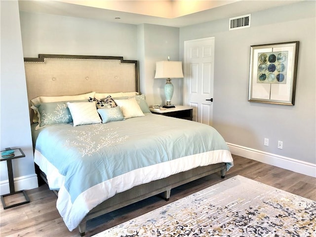 bedroom featuring hardwood / wood-style flooring