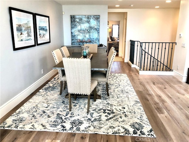 dining area featuring light wood-type flooring