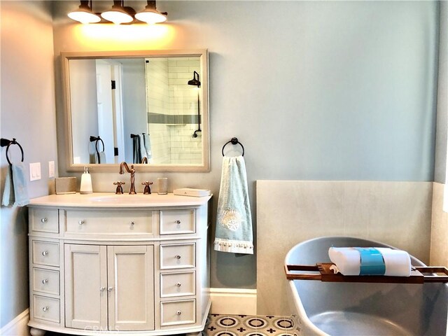 bathroom featuring vanity and a tile shower