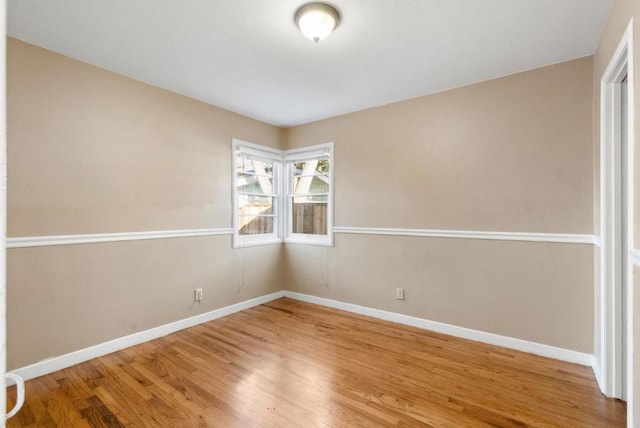 unfurnished room featuring wood-type flooring