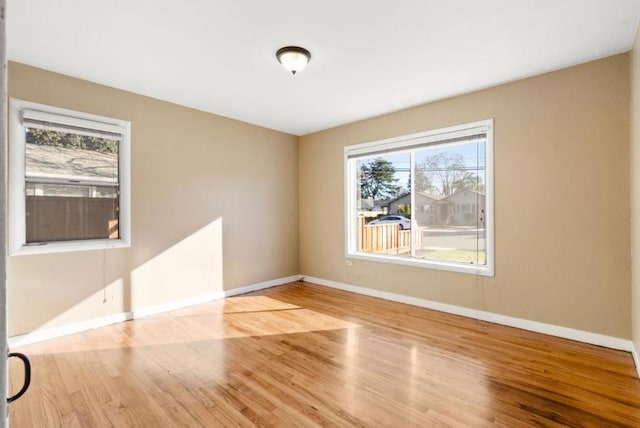 unfurnished room featuring light wood-type flooring