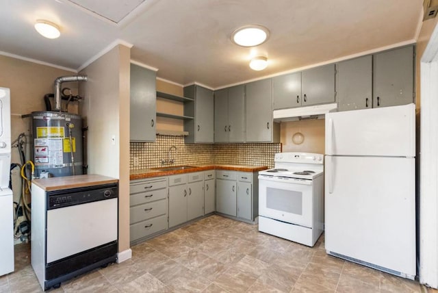 kitchen with crown molding, sink, backsplash, white appliances, and water heater