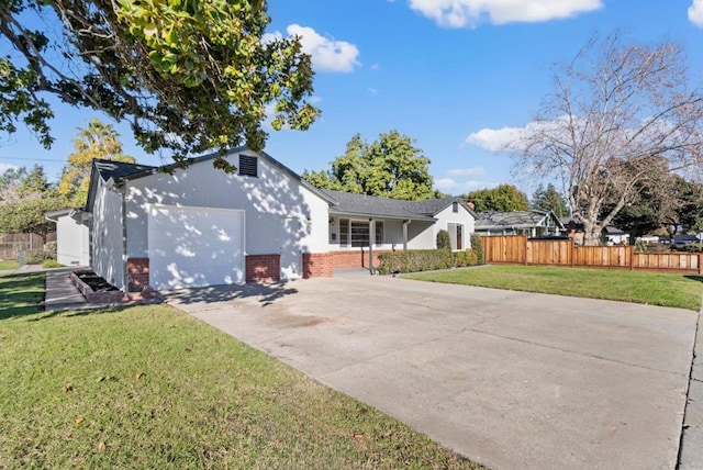 view of front of property featuring a garage and a front yard