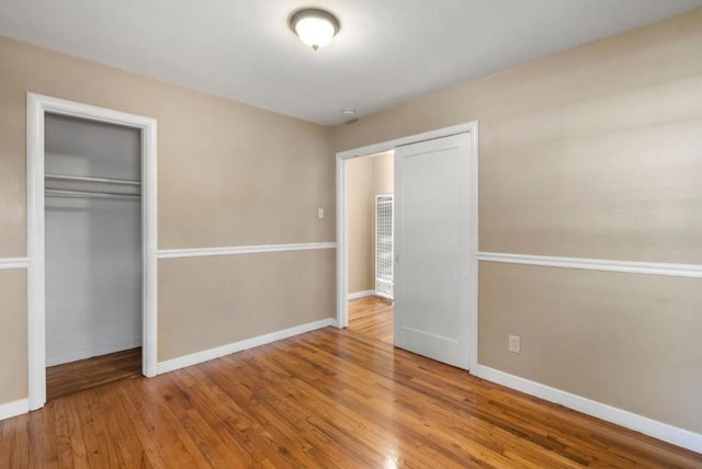 unfurnished bedroom featuring hardwood / wood-style floors